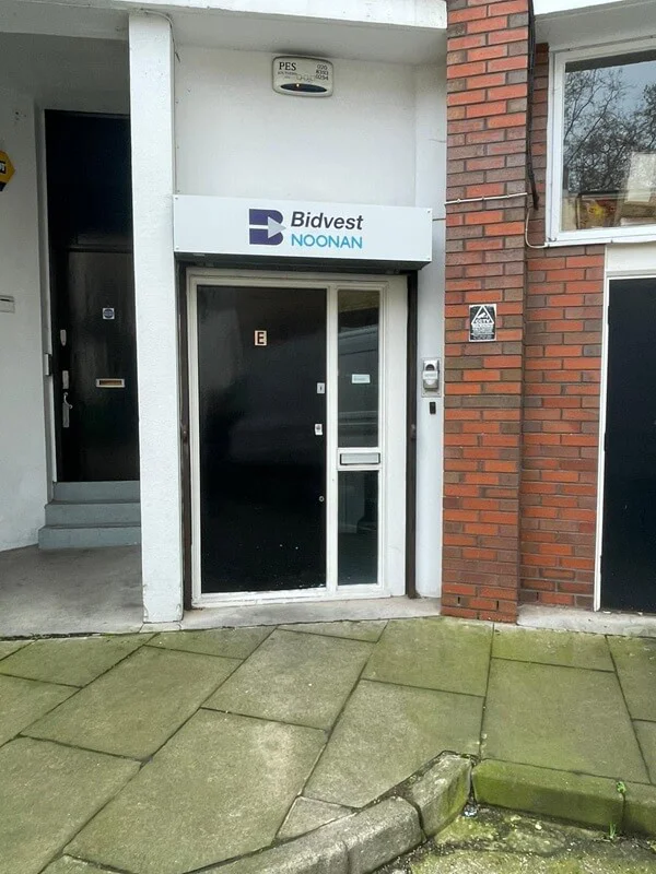 An image of the exterior Bidvest Noonan exterior signage above the door.